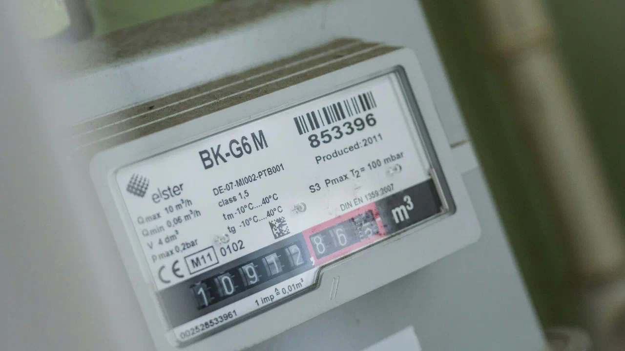 A close-up of an electricity meter mounted on a wall